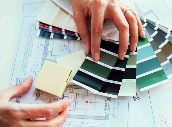 woman comparing material samples for an alteration