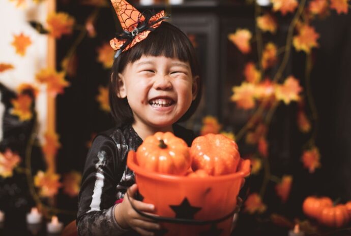 girl smiling at home in Halloween costume