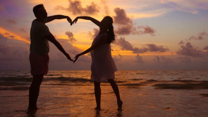 photo of a young couple on the beach