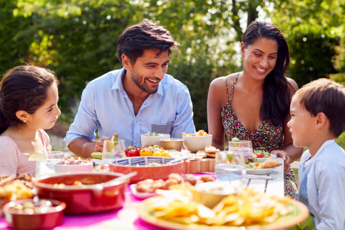 family having dinner outside